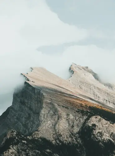 Mountain peak shrouded in clouds