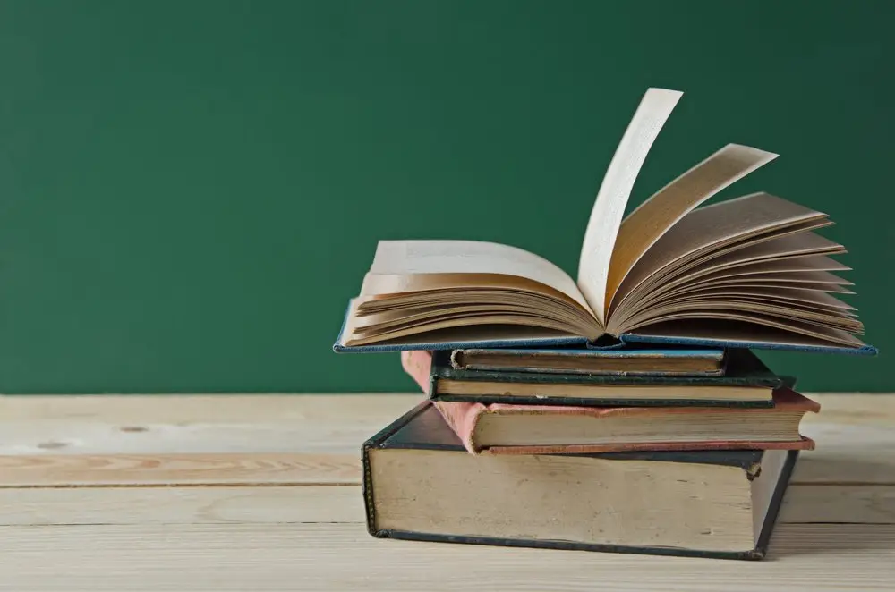 Stack of books on wooden surface